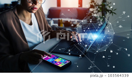 オフィスで作業する女性とネットワークイメージ オフィスで作業する女性とネットワークイメージ 103564339
