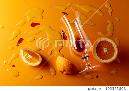 Cocktail "Tequila sunrise" on a orange background. 103565808