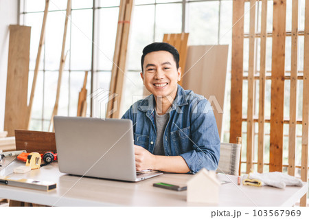 Portrait middle age adult southeast asian man carpenter job working at home 103567969