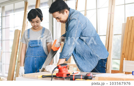 Southeast asian family father and son diy or repair for crafts skill at home workshop Southeast asian family father and son diy or repair for crafts skill at home workshop 103567976