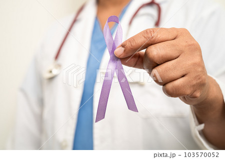 Asian woman doctor with purple ribbon, sign of Alzheimer disease day, Pancreatic cancer, Epilepsy, Lupus. Asian woman doctor with purple ribbon, sign of Alzheimer disease day, Pancreatic cancer, Epilepsy, Lupus. 103570052