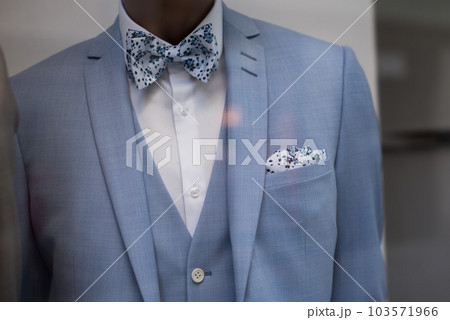 Closeup of blue wedding suit on mannequin in wedding store showroom 103571966
