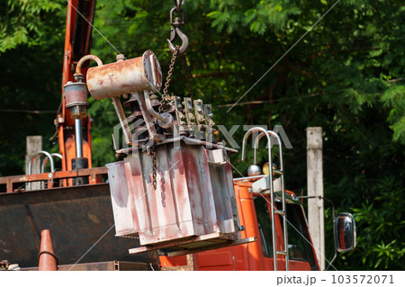 crane hook lifts up old distribution transformer crane hook lifts up old distribution transformer 103572071