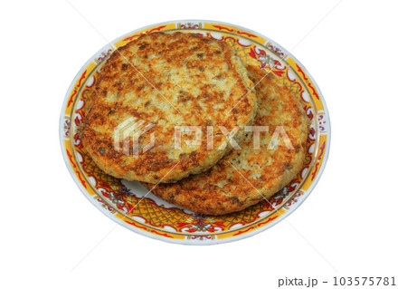 Cutlets on a plate isolated on white background. Homemade meatballs. Portion of sliced meat breaded and served either grilled or fried. Cutlets on a plate isolated on white background. Homemade meatballs. Portion of sliced meat breaded and served either grilled or fried. 103575781