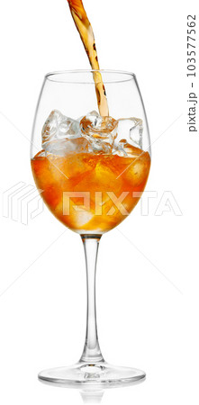 aperol spritz pouring in glass with ice isolated on white 103577562