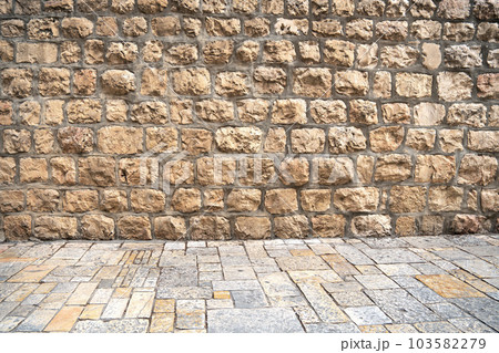 Ancient brick wall and pavement of old city of Jerusalem, Israel Ancient brick wall and pavement of old city of Jerusalem, Israel 103582279