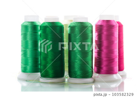 set of different color sewing threads,on white background. 103582329