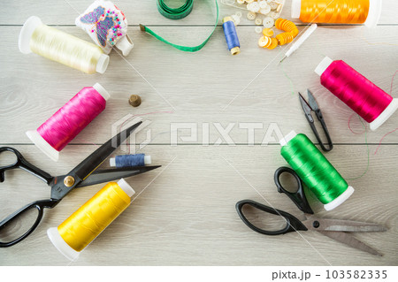 a set of tools and threads for sewing clothes 103582335
