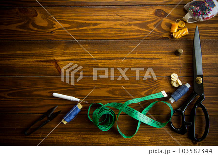 a set of tools and threads for sewing clothes a set of tools and threads for sewing clothes 103582344