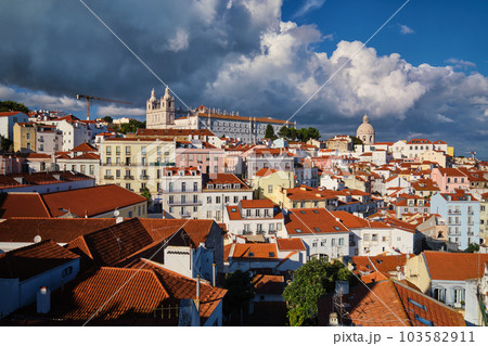 View of Lisbon famous postcard iconic view from Miradouro de Santa Luzia tourist viewpoint over Alfama old city district. Lisbon, Portugal. 103582911