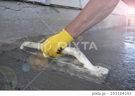 Mason leveling and screeding concrete floor base 103584102