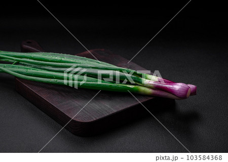 Fresh green onions for cooking a healthy vegetarian dish Fresh green onions for cooking a healthy vegetarian dish 103584368