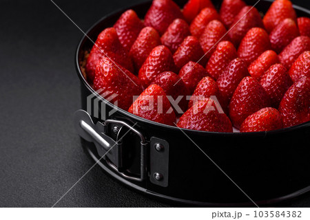 Delicious sweet cake or cheesecake with mascarpone cheese and strawberries Delicious sweet cake or cheesecake with mascarpone cheese and strawberries 103584382