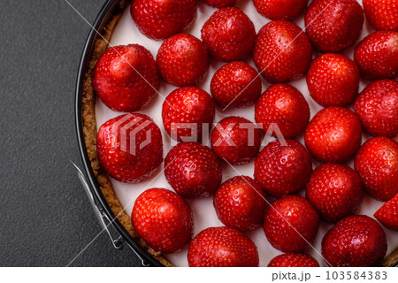 Delicious sweet cake or cheesecake with mascarpone cheese and strawberries Delicious sweet cake or cheesecake with mascarpone cheese and strawberries 103584383