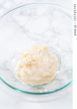 Preparing tangzhong in a small saucepan to bake homemade bread. Preparing tangzhong in a small saucepan to bake homemade bread. 103585795