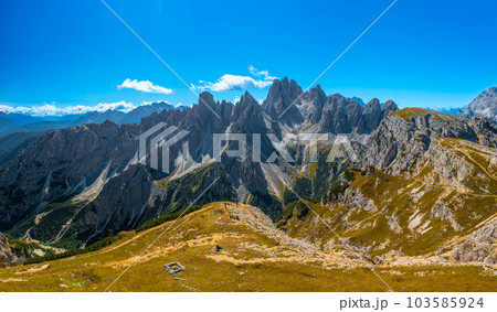 Majestic Rocky Peaks Embraced by Blue Sky and White Clouds near the Three Peaks of Lavaredo 103585924