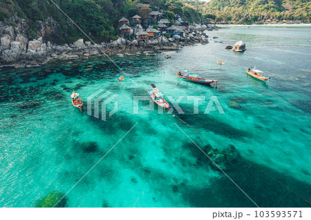 Island and boat in clear sea at Koh Tao 103593571