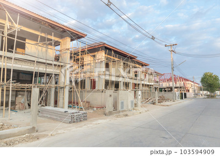construction residential new house in progress at building site construction residential new house in progress at building site 103594909