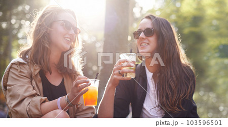 Relax, women and friends with drinks, outdoor and happiness for bonding, quality time and cheers. Female people, girls and ladies drinking, outside and celebration with joy, cheerful and social event 103596501