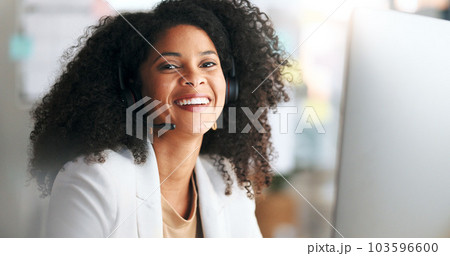 Call center or customer support agent looking happy while wearing headphones and working inside. Portrait of a laughing remote worker enjoying her job, offering great service and explaining products 103596600