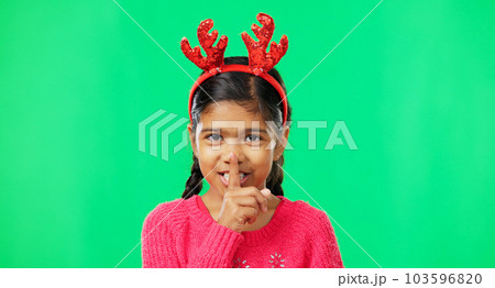 Shush, Christmas and secret with girl in green screen studio for holiday, gossip and gift. Surprise, festive and announcement with child isolated in background for celebration, privacy and present Shush, Christmas and secret with girl in green screen studio for holiday, gossip and gift. Surprise, festive and announcement with child isolated in background for celebration, privacy and present 103596820