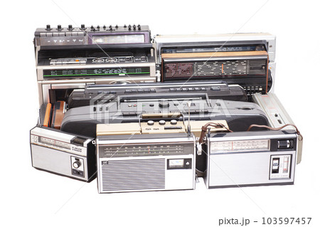 Collection of old tape recorders and transistor radio 103597457
