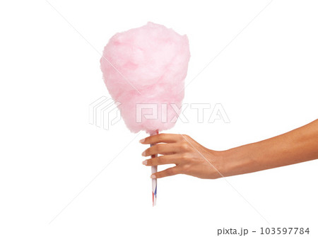 Closeup, woman and hand with cotton candy, dessert and sweets isolated against a white studio background. Zoom, female person and model with a carnival snack, tasty and fingers with sugar clouds 103597784