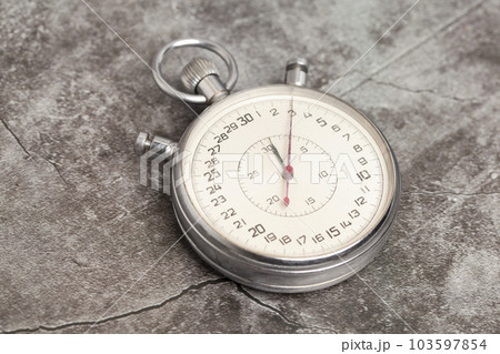 Old stopwatch on a gray background 103597854