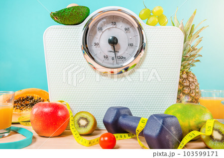Fitness with dumbbell and genuine food with fresh fruit 103599171