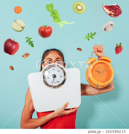 woman is afraid of weight measurement with scale 103599215