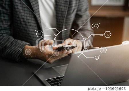 Elearning online working concept. Business man working on smartphone and laptop computer. 103603698