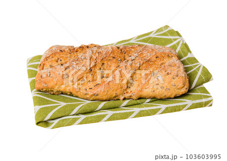 Freshly baked delicious french bread with napkin isolated on white background top view. Healthy white bread loaf 103603995