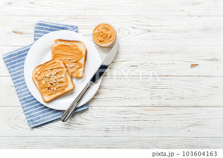 Peanut butter sandwiches or toasts on light table background.Breakfast. Vegetarian food. American cuisine top view vith copy space 103604163