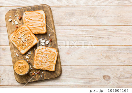 Peanut butter sandwiches or toasts on light table background.Breakfast. Vegetarian food. American cuisine top view vith copy space 103604165