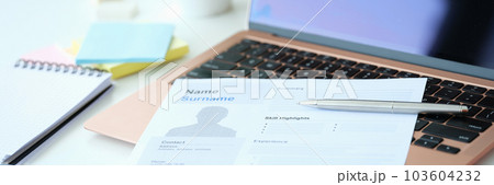 Blank resume form on computer on table Blank resume form on computer on table 103604232