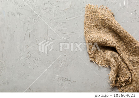 Old burlap fabric napkin, sackcloth on table background. top view with copy space Old burlap fabric napkin, sackcloth on table background. top view with copy space 103604623
