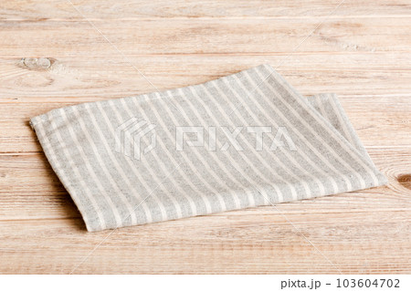 top view with gray kitchen napkin isolated on table background. Folded cloth for mockup with copy space, Flat lay. Minimal style 103604702