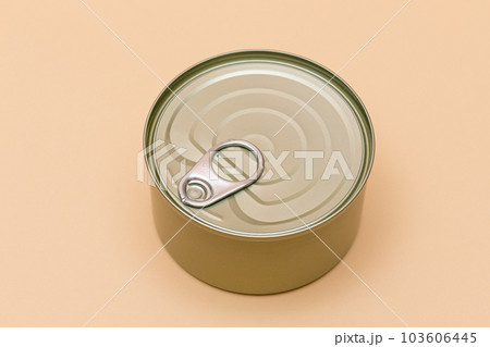 Unopened Tin Can with Blank Edge on Beige Background Unopened Tin Can with Blank Edge on Beige Background 103606445