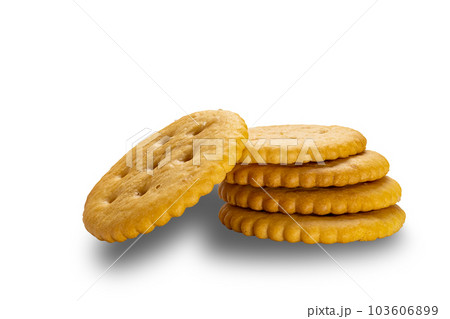 Side view stack of crunchy salted round crackers isolated on white background. 103606899