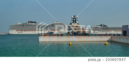 Old Doha port (Mina District) in Doha, Qatar afternoon shot showing cruise ship ( MSC World Europa) . Old Doha port (Mina District) in Doha, Qatar afternoon shot showing cruise ship ( MSC World Europa) . 103607847