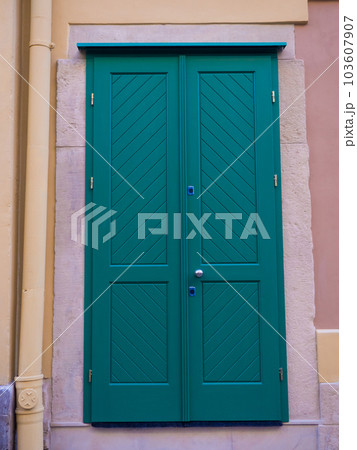 Green wooden door 103607907