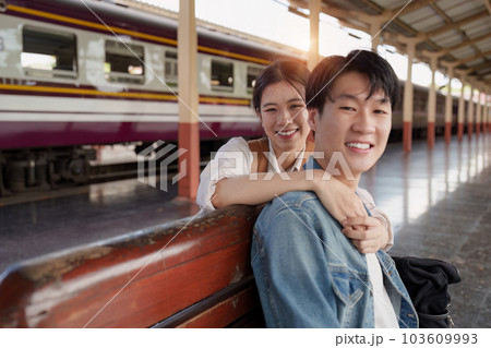 Asian couple at railway station have happy moment. Tourism and travel in the summer Asian couple at railway station have happy moment. Tourism and travel in the summer 103609993
