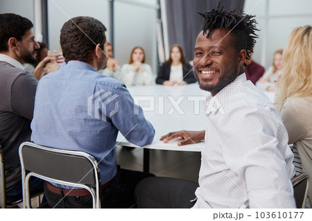 handsome african businessman with group of businesspeople on background 103610177