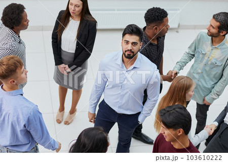 a large group of people meet in the office corridor. office life a large group of people meet in the office corridor. office life 103610222