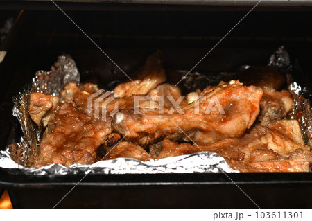 Pork meat cooked in the oven on the ribs lies on a baking sheet. Pork meat cooked in the oven on the ribs lies on a baking sheet. 103611301