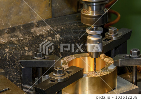 The drilling process on NC milling machine with brass material. The drilling process on NC milling machine with brass material. 103612238