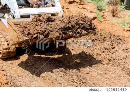 In order to carry out construction improvement work designated site will make territory by employing tractor In order to carry out construction improvement work designated site will make territory by employing tractor 103612419