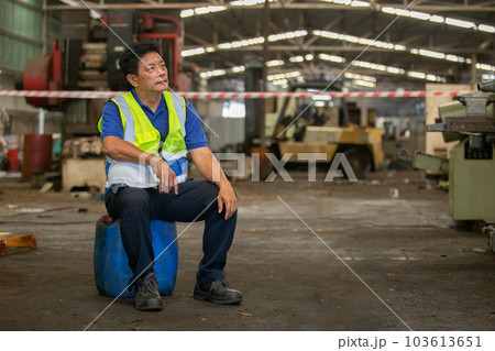 Senior male Industrial factory workers are exhausted and stressed from hard work. Senior male Industrial factory workers are exhausted and stressed from hard work. 103613651