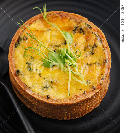 Plate of many mini bite size quiche appetizers 103613867