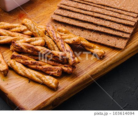 Tasty Assorted Dips on wooden tray 103614094